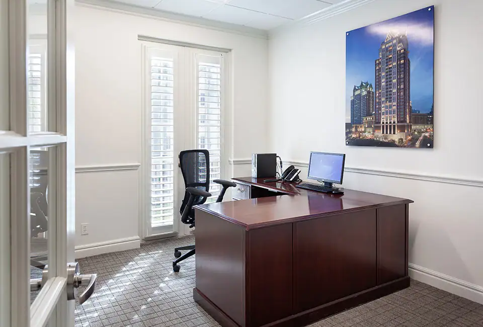 A mahogany desk inside an office in The Suites at 231.
